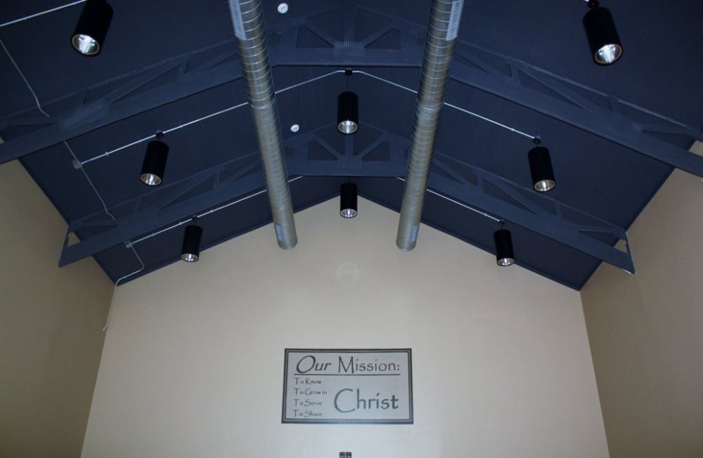 A sign on a wall that says a mission christ